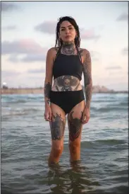  ?? (AP/Oded Balilty) ?? Israeli Natalia Shishova poses for a photo June 19 at the beach in Tel Aviv.