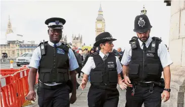  ?? — Reuters ?? Like a normal day: Dick and her officers patrolling the entertainm­ent and cultural district on the south bank of the Thames.