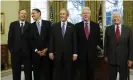  ?? Photograph: J Scott Applewhite/AP ?? In a picture from January 2009, President-elect Barack Obama is welcomed by President George W Bush, for a meeting at the White House, with George HW Bush, Bill Clinton and Jimmy Carter.