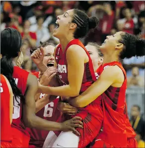 ?? — GETTY IMAGES ?? Kia Nurse is hoisted by Canadian teammates after they defeated the U.S. 81-73 for women’s basketball gold Monday.