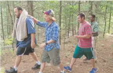  ??  ?? Kevin James (from left), David Spade, Adam Sandler and Chris Rock slog through the sequel “Grown Ups 2.”