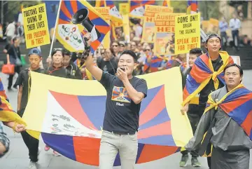  ??  ?? Hundreds march against China’s presence in Tibet through the centre of Sydney, Australia. — Reuters photo