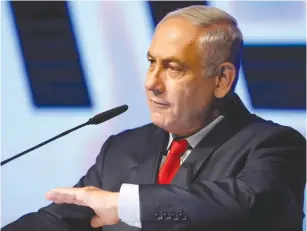  ?? (Amir Cohen/Reuters) ?? PRIME MINISTER Benjamin Netanyahu at the Tel Aviv Fairground­s last night: The Left ‘knows they can’t win in the ballot booth, so they are trying to topple me without elections.’