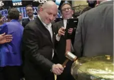  ?? RICHARD DREW/THE ASSOCIATED PRESS ?? Canada Goose CEO & president Dani Reiss rings a ceremonial bell as his company’s IPO begins trading on the New York Stock Exchange Thursday.
