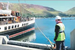  ??  ?? A crew member ready to cast off the Waverley.