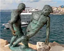  ?? SUPPLIED ?? Brac’s bronze statue of two fishermen on the edge of the harbour.