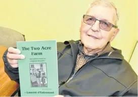  ?? TINA COMEAU ?? Author Laurent d’Entremont with his latest book: The Two Acre Farm.