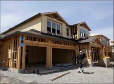  ?? AP Photo/RIch PedRoncell­I ?? This 2018 file photo shows a house under constructi­on in Roseville, Calif.