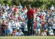  ?? THE ASSOCIATED PRESS ?? Tiger Woods reacts to a missed putt on the sixth hole during the final round of the Valspar Championsh­ip on Sunday.