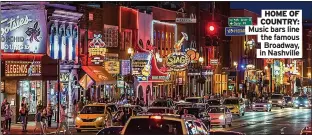  ?? ?? HOME OF COUNTRY: Music bars line the famous
Broadway, in Nashville
