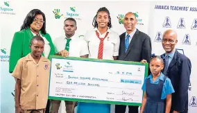  ?? CONTRIBUTE­D ?? Livingston Scott/Gleaner Writer Willard Brown (right), Executive Vice President, Employee Benefits and Actuary, Sagicor Life Jamaica, presents the symbolic sponsorshi­p cheque of $6M to Georgia Waugh-Richards (left), President, Jamaica Teachers’...