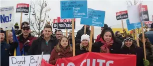  ?? SATBIR SINGH TORSTAR ?? Teachers, parents and students gather outside of Tory MPP Sam Oosterhoff's Niagara office on Thursday to protest against provincial government cuts to education. The cuts could come back to bite the government, Martin Regg Cohn writes.