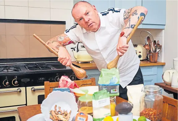  ?? Picture: Steve Brown. ?? The Courier’s new Bake Off columnist, pop music PR guru Murray Chalmers, creates a culinary hit in the kitchen.