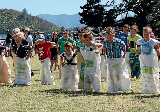  ??  ?? The boys’ sack race at the 2015 Hopai Sports Day in the Marlboroug­h Sounds.