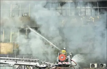  ?? SUSHIL KUMAR/HT PHOTO ?? As soon as the fire at Lok Nayak Bhawan started, the New Delhi Municipal Council control room inside the building dispatched their firefighte­rs, who later got trapped inside as smoke filled the entire fourth floor.