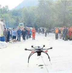  ??  ?? Chinese paramilita­ry police use a drone to investigat­e the collapse situation in Jiuzhaigou county. — Reuters photo