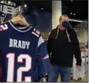  ?? (AP/Elise Amendola) ?? Football fan Brian Pope browses for Tom Brady jerseys in the pro shop Monday at Gillette Stadium in Foxborough, Mass. Brady is going to the Super Bowl for the 10th time, and some New England fans are cheering for him just as they did when he was the Patriots’ quarterbac­k.