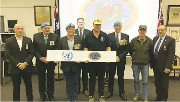  ?? ?? District people that served with Australian peacekeepi­ng and peacemakin­g contingent­s on United Nations missions proudly display a plaque that now features at the front of the Warragul RSL clubrooms. From left are Sam Dessent, John Dunk, Gary Whelband, David Trippier, David Innes, John Brookes and Gary Blackwood.