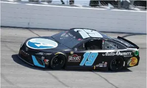  ?? The Associated Press ?? ■ Martin Truex Jr. drives into Turn 1 during Sunday’s NASCAR Cup Series race at Darlington Raceway in Darlington, S.C.