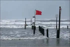  ?? THE ASSOCIATED PRESS ?? Water rises at Bob Hall Pier in Corpus Christi, Texas as Hurricane Harvey approaches on Friday, Aug. 25, 2017. The slow-moving hurricane could be the fiercest such storm to hit the United States in almost a dozen years. Forecaster­s labeled Harvey a...