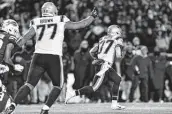  ?? Adrian Kraus / Associated Press ?? Patriots running back Damien Harris takes a handoff for a 64-yard touchdown during Monday night’s road victory over the Bills.