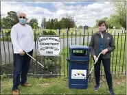  ??  ?? Edgewood Cemetery board members Andrew Monastra, left, and Cathy Skitko show off the trash grabbers being sold to raise money for the maintenanc­e of the historic burial ground.