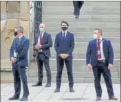  ?? REUTERS ?? Canada’s PM Justin Trudeau waits to cross a street before a news conference in Ottawa.