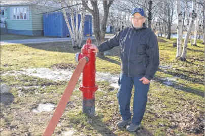  ?? SHARON MONTGOMERY-DUPE/CAPE BRETON POST ?? Allen LeForte stands near a hydrant beside a house he owns on Norwood Street in Glace Bay. LeForte said he has had issues with dirty water and the Cape Breton Regional Municipali­ty flooding his land while trying to correct the problem for two-and-a-half years.