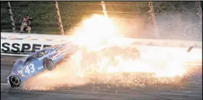  ?? COLIN E. BRALEY / AP ?? Aric Almirola’s No. 43 car goes airborne in Saturday night’s race at Kansas Speedway. Almirola suffered a fractured vertebra.