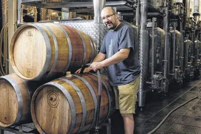  ?? ?? Winemaker Jurg Stutz blends Tidal Bay in the cellar at Domaine de Grand Pre.