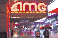  ?? AFP file photo ?? A closed AMC movie theatre is seen near Time Square in New York City. —