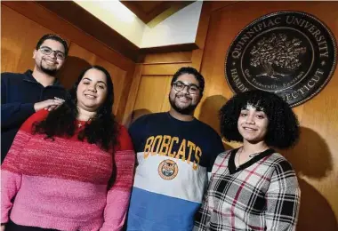  ?? Arnold Gold/Hearst Connecticu­t Media ?? From left, Sebastian Vacco, with his younger triplet siblings, Ashley, Lucas and Jade, at Quinnipiac University in Hamden last week. The triplets from Nanuet, N.Y., all transferre­d to Quinnipiac.