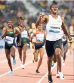  ?? — AFP ?? A class above the rest: South African athlete Caster Semenya (right) reacts as she crosses the finish line to win the women’s 1,500m during the Diamond League athletics competitio­n in Doha on Friday.