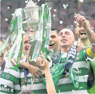  ??  ?? CUP FOR IT: Scott Brown lifts the trophy after Celtic’s victory at Hampden Park