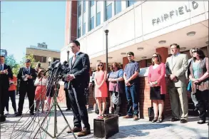  ?? Ned Gerard / Hearst Connecticu­t Media ?? Attorney Joshua Koskoff stands with Sandy Hook family members suing Remington for wrongful death in front of the Fairfield County Courthouse in Bridgeport on June 20, 2016.