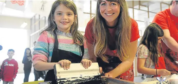  ??  ?? Martha Jones, left, and Jude Gove, learning coordinato­r at DCA, enjoy the last day of Dundee Design Festival.