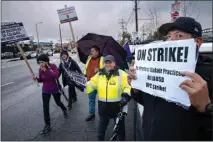  ?? DAVID CRANE — STAFF PHOTOGRAPH­ER ?? SEIU workers and teachers picket outside of Polytechni­c High School in Sun Valley on Wednesday. The workers, who include bus drivers, food workers and janitors, are on Day Two of a three-day strike for higher wages. California has more union members than any other state.