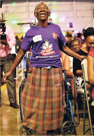  ?? ANTHONY MINOTT ?? As the spirit moved through the National Indoor Sports Centre on Thursday, this woman jumped to her feet and danced. She was among scores who attened the Internatio­nal Women’s Day concert that was put on by the Entertainm­ent Ministry.