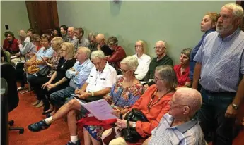 ?? Photo: Tom Gillespie ?? OPPOSITION: Crowds of people turned out to the Toowoomba Regional Council chambers for the decision on the developmen­t at Prince Henry Heights in March.