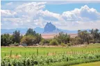  ?? ANTHONY JACKSON/JOURNAL ?? Shiprock is seen from farmland in the Navajo Nation. The COVID-19 pandemic has hampered efforts to count residents for the 2020 census.