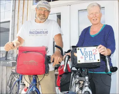  ?? MILLICENT MCKAY/JOURNAL PIONEER ?? Dennis Duemeier, left, and Jane Henderson with their bikes outside their Summerside home. The husband and wife duo recently completed a 10-week cycling trip across most of Canada.