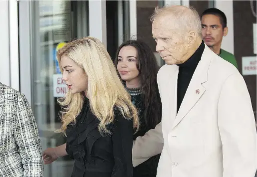  ?? Liam Richards / The Cana dian Press files ?? Retired Manitoba senator Rod Zimmer and his wife, Maygan Sensenberg­er, leave provincial court in Saskatoon, in 2012.
Sensenberg­er is now accused of attacking two people at an Ottawa clinic and assaulting three police officers.