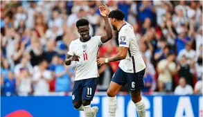  ?? PICTURE: Shaun Botterill/getty Images ?? Bath-born Tyrone Mings celebrates with England goalscorer Bukayo Saka during their 4-0 win over Andorra in the World Cup qualifiers