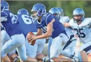  ?? Steven Eckhoff ?? Armuchee quarterbac­k Devin Pledger heads to the left side of the line to look for an opening during the Indians’ spring game against Coahulla Creek on Friday.