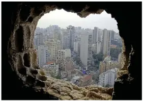  ?? ?? overview: View from one of the snipers’ nests in the Holiday Inn, Beiruit, Lebanon, and, below, press outside the city’s Hotel Commodore