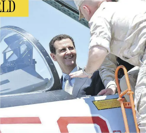  ?? SYRIAN PRESIDENCY FACEBOOK PAGE / AFP / GETTY IMAGES ?? Syrian President Bashar al-Assad sits inside a Sukhoi Su-27 jet during a recent visit to the Russian-run Hmeimim military base. The White House warned Syria on Monday against further use of chemical weapons.