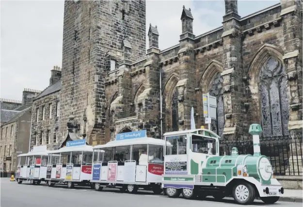 ??  ?? 0 Land trains similar to this one in action in St Andrews could be seen on Edinburgh’s Royal Mile which attracts four million visitors a year