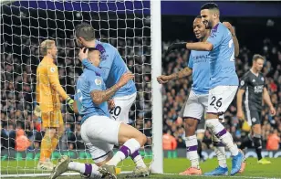  ?? Picture: Lindsey Parnaby / AFP ?? Manchester City's Brazilian striker Gabriel Jesus, left, celebrates with teammates after scoring their third goal during the English Premier League football match against Leicester City at the Etihad Stadium in Manchester yesterday.