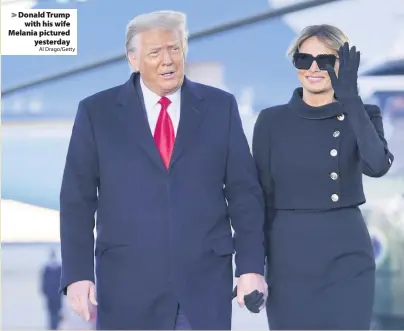  ?? Al Drago/Getty ?? Donald Trump with his wife Melania pictured yesterday