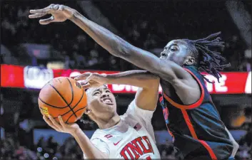  ?? L.E. Baskow Las Vegas Review-journal @Left_eye_images ?? UNLV guard Dedan Thomas Jr. had one of the best freshman seasons in program history, not only as a great player but as an emotional leader.